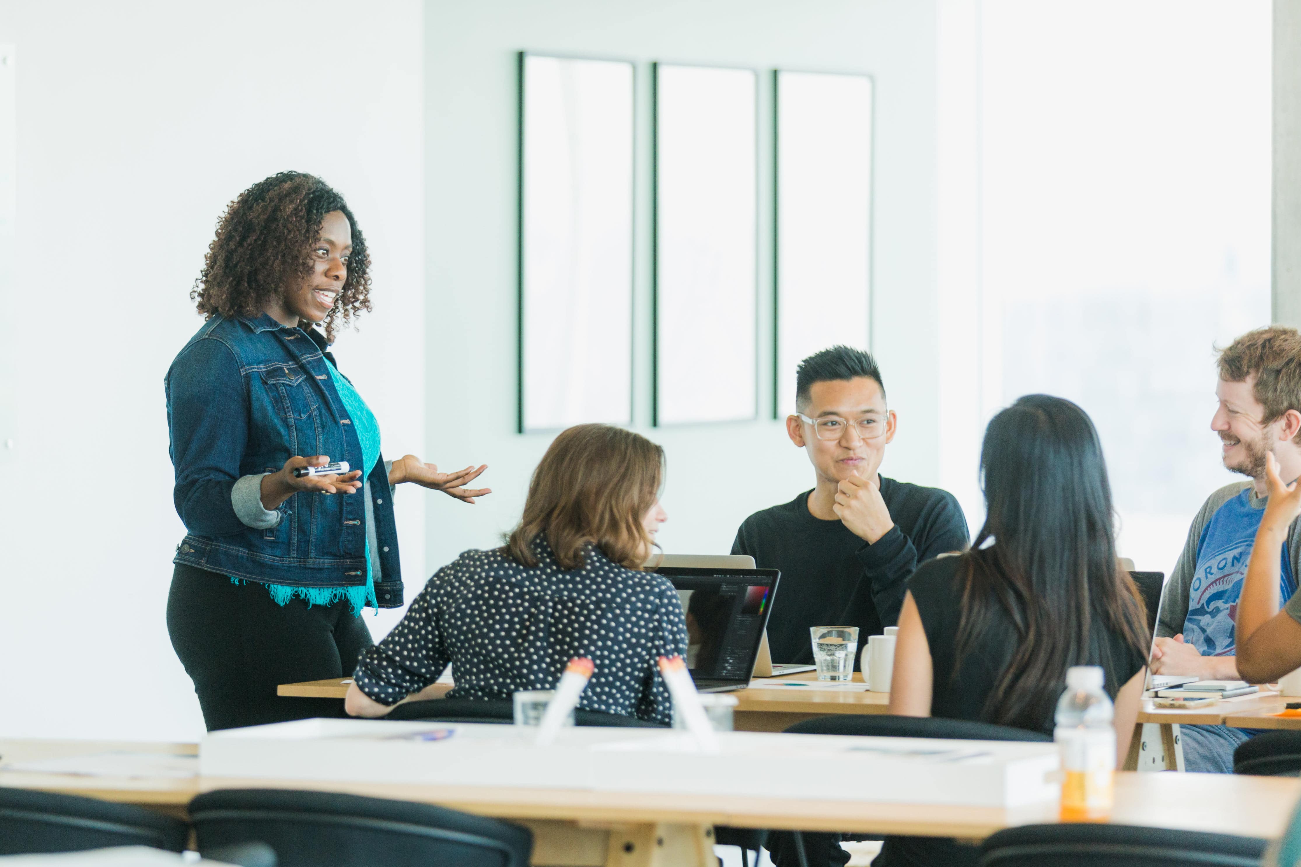 Teacher and high schools students working together